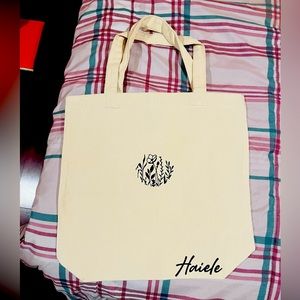 Tote bag with a choice of your design and name.